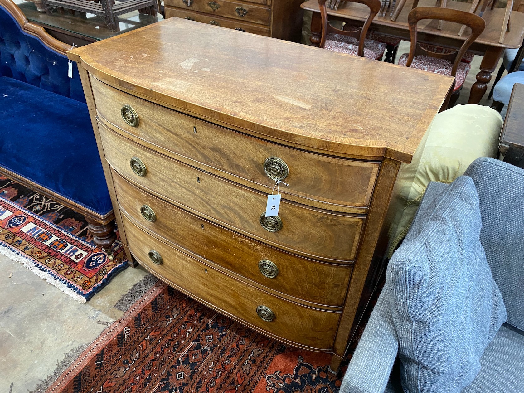 A Regency banded faded mahogany bowfront chest of four graduated long drawers, width 108cm, depth 58cm, height 100cm